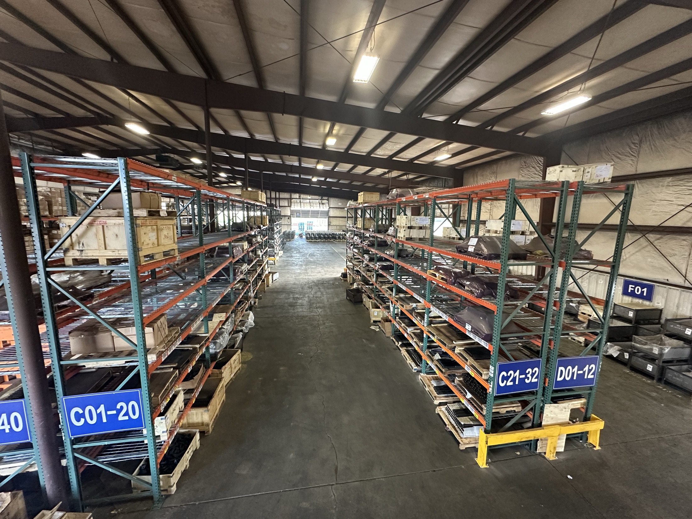 Organized pallet racking with location-coded bins